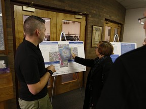 Residents looks at a map of Beaumaris Lake at Good Shepherd Anglican Church, 15495 Castle Downs Rd. on Saturday, Nov. 18, 2017.