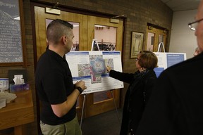 Residents looks at a map of Beaumaris Lake at Good Shepherd Anglican Church, 15495 Castle Downs Rd. on Saturday, Nov. 18, 2017.