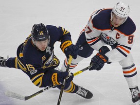 Buffalo Sabres Jack Eichel (15) and Edmonton Oilers Conor McDavid (97) in action during the third period of an NHL hockey game, Friday Nov. 24, 2017, in Buffalo, N.Y.