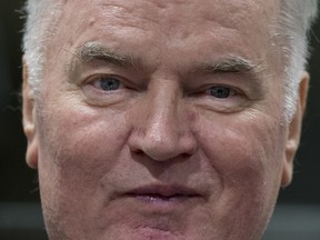 Bosnian Serb military chief Ratko Mladic enters the Yugoslav War Crimes Tribunal in The Hague, Netherlands, Wednesday, Nov. 22, 2017, to hear the verdict in his genocide trial.