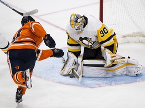 Edmonton Oilers Drake Caggiula (91) can't get the puck past Pittsburgh Penguins goalie Matt Murray (30) during first period NHL action on Wednesday November 1, 2017, in Edmonton.