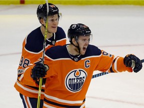 Edmonton Oiler captain Connor McDavid celebrates after scoring in second period NHL game action against the Toronto Maple Leafs in Edmonton on Thursday November 30, 2017. Behind him is team mate Jesse Puljujarvi. (PHOTO BY LARRY WONG/POSTMEDIA) Photos for copy in Friday, Dec. 1 edition.