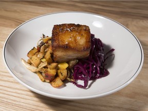 The pork belly at Pip restaurant in Edmonton's Old Strathcona is paired nicely with a warm fennel and apple slaw, alongside a mound of pickled red cabbage.