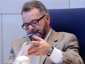 Edmonton city Coun. Tony Caterina, shown during budget deliberations, has a file several inches thick of complaints by city employees who have appealed to him for help.