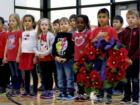 Students at Constable Daniel Woodall School in Edmonton celebrate Remembrance Day during a school assembly on Wednesday November 8, 2017.