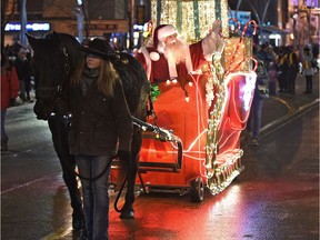 Of course Santa stole the show in a horse drawn sleigh, as people lined up along the street for a festive celebration of Christmas by watching Santa's Parade of Lights along Jasper Ave. in Edmonton, November 18, 2017.