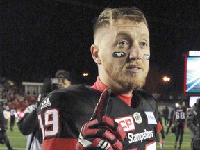 Bo Levi Mitchell flashes a number one symbol following the CFL Western Final in Calgary between the Calgary Stampeders and the Edmonton Eskimos on Sunday, November 19, 2017.