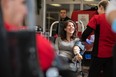 Jennifer McNalley, an instructor at NAIT, rolls up her sleeves to donate blood for her colleague and friend, Charles Neher, who was injured when an almost 15-metre poplar fell on him in July. He spent about four months in the hospital and was sent home this month.