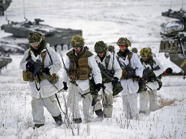 Soldiers participate in Exercise IRON RAM, a Canadian army field exercise of a simulated attack at Canadian Forces Base/Area Support Unit Wainwright on Friday Nov. 3, 2017.