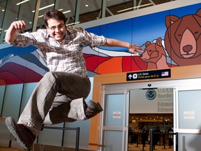 Jason Carter with his work Old Man Mountain with Great Mother Bear, on display at the Edmonton International Airport.