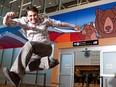 Jason Carter with his work Old Man Mountain with Great Mother Bear, on display at the Edmonton International Airport.