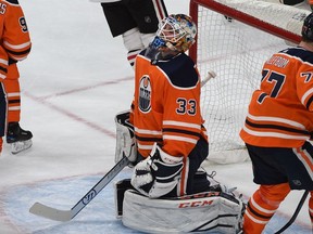 Chicago Blackhawks Alex DeBrincat celebrates his goal on Edmonton Oilers goalie Cam Talbot (33) during NHL action at Rogers Place in Edmonton, December 29, 2017.