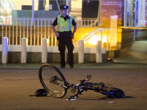 Police investigate after an officer fired at a truck in a parking lot near 99 Street and Whyte Avenue on Wednesday, Aug. 30, 2017.