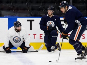 Patrick Maroon, Connor McDavid, and Milan Lucic take part in an Edmonton Oilers practice on Dec. 1, 2017, at Rogers Place in Edmonton.
