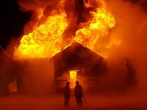 Fire crews battle a blaze that destroyed the Leslieville Elks Hall on Friday. Photo supplied by Scott Finkbeiner/Facebook