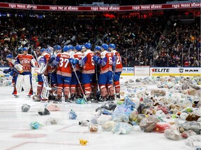 The Edmonton Oil Kings celebrate Davis Koch's goal against the Prince Albert Raiders as teddy bears rain down from the crowd during the 2017 Teddy Bear Toss at Rogers Place in Edmonton on Dec. 2, 2017.