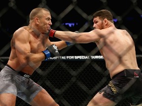 Georges St-Pierre of Canada fights Michael Bisping of England in their UFC middleweight championship bout during the UFC 217 event at Madison Square Garden on November 4, 2017 in New York City.