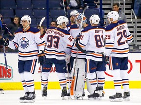 COLUMBUS, OH - DECEMBER 12:  Laurent Brossoit #1 of the Edmonton Oilers is congratulated by his teammates after defeating the Columbus Blue Jackets 7-2 on December 12, 2017 at Nationwide Arena in Columbus, Ohio.