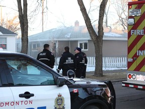 Police and fire investigators were at the scene of a fire in a vacant house at 9609 120 Ave. in Edmonton, Alta., after being called by a passerby around 8:30 a.m. Monday, Dec. 18, 2017.