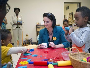 Danielle Larivee, minister of children's services, talks with children at the Africa Centre Childcare and Early Learning Program in June 2017.