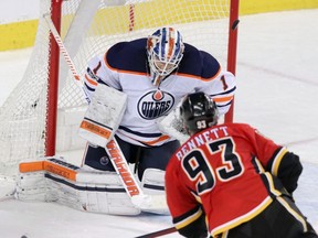 Calgary Flames Sam Bennett scores on Edmonton Oilers goalie Laurent Brossoit during third period NHL hockey action in Calgary, Saturday, Dec. 2, 2017.