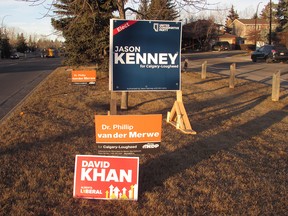 Campaign signs for candidates in the upcoming Calgary-Lougheed byelection.