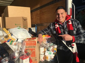 Dan Johnstone, also known as Can Man Dan, shows off food collected during his third of four campouts raising donations and awareness for the Edmonton Food Bank outside the Sobey's grocery store at 16943 127 St. on Friday, Dec. 15, 2017. Johnstone's seventh annual camp out raised over $55,000 and 50,000 kilograms of food donations for the Edmonton Food Bank.