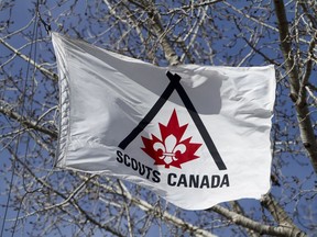 A flag waves outside the Scouts Canada Service Centre in Calgary on Wednesday March 30, 2011