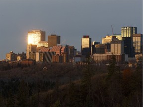 The sunrise reflects of downtown buildings in Edmonton, Alberta on Thursday, Oct. 26, 2017.