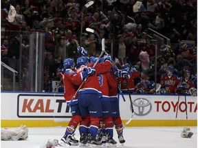 Edmonton's Nick Bowman (13) celebrates his goal, which set off the 2016 Teddy Bear Toss, during a WHL game between the Edmonton Oil Kings and the Kamloops Blazers at Rogers Place in Edmonton, Alberta on Saturday, December 10, 2016.