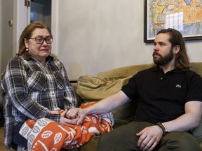 Maria Chaves-Turbide (left) and her son Tom Ferreira warn others about binary options trading after her husband Frederick Turbide was driven to suicide over massive losses in Edmonton on Wednesday, February 15, 2017.