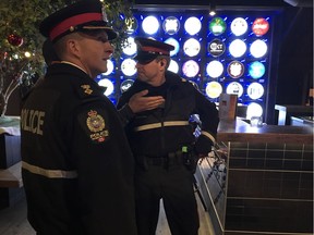 Supt. Tom Pallas, left, and Sgt. Michael Elliott do a walkthrough at an Old Strathcona bar during a walkalong Postmedia attended in December 2017. Elliott was elected president of the Edmonton Police Association Friday.