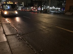 The wet roads of downtown Edmonton on Friday, Dec. 15, 2017.