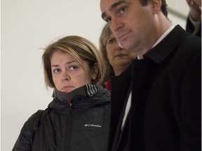 Liberal MP Sherry Romanado is flanked by colleagues as she leaves a committee meeting, in Ottawa on Monday, Dec. 4, 2017. Romanado rose earlier in the House of Commons and claimed that Conservative MP James Bezan had made comments towards her that were "humiliating" and "sexual in nature."