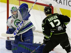 Edmonton Oil King Liam Keeler looks for a rebound as Swift Current Bronco goalie Logan Flodell makes a save during WHL game action in Edmonton on Sunday December 10, 2017.