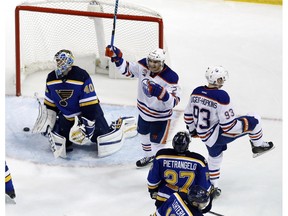 Edmonton Oilers defenceman Andrej Sekera, seen here celebrating teammate Ryan Nugent-Hopkins's (93) overtime winner against the St. Louis Blues one year ago, is preparing to return to active duty for the first time this season following knee surgery. (File)
