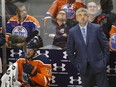 Edmonton Oiler head coach Todd McLellan (right) looks up at the clock as his team loses another game, this time against the Philadelphia Flyers in Edmonton on Wednesday Dec. 6, 2017.