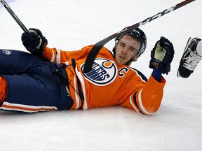 Edmonton Oiler captain Connor McDavid is dumped during first period NHL game action against the Toronto Maple Leafs in Edmonton on Thursday November 30, 2017.