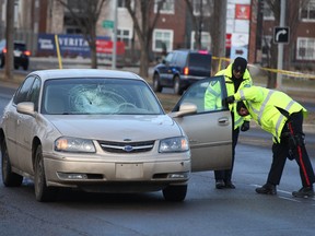 Edmonton police investigate a serious pedestrian and car collision at 137 Avenue and 102 Street, Friday morning. Photo by David Bloom