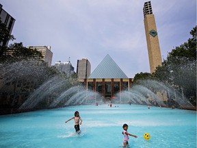 Kids play in the wading pool at City Hall as temperatures soar in Edmonton, Alta., on Tuesday, July 15, 2014.