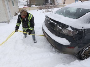 Good samaritan Chad (no last name given) tows a motorist out of the snow, in Edmonton. File photo.