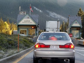 Vehicles slow down to check in at the  Jasper National Park gates on highway #16 on Wednesday Oct. 1, 2013. Tom Braid/Edmonton Sun/QMI Agency
