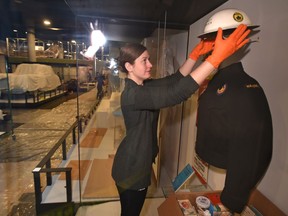 Susan Green, a conservator, installing items in a nuclear readyness exhibit in the human history gallery as the media were taken on a brief behind the scenes look at the Royal Alberta Museum as it continues to install artifacts into exhibits, in Edmonton, Dec. 6, 2017.