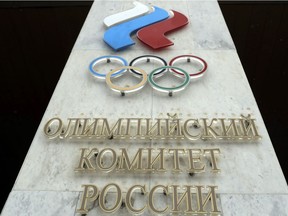 The logo of the Russian Olympic Committee is mounted at the entrance of the head office in Moscow, Russia, Wednesday, Dec. 6, 2017. The International Olympic Committee has barred the Russian team from competing at the Winter Olympics in Pyeongchang in February over widespread doping at the last  Winter Games in 2014.