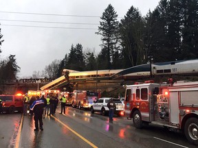 This photo provided by Washington State Patrol shows an Amtrak train that derailed south of Seattle on Monday, Dec. 18, 2017. The train derailed about 40 miles (64 kilometers) south of Seattle before 8 a.m., spilling at least one train car on to busy Interstate 5.