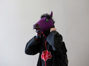 Dressed as a horse-headed version of the character Itachi Uchiha from the animated series Naruto, Mason Clabert, 19, walks around Animethon at the MacEwan University Downtown Campus in Edmonton Friday, Aug. 11, 2017. Animethon is a Japanese Animation (anime) themed festival hosted by The Alberta Society for Asian Popular Arts.