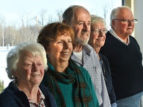 Mary Jane Galusha, 89, left, Audrey Barner, 75, Henk Albarda, 86, Doreen Valentine, 85 and Denis Brown, 76, are pulling together for the final reunion of former Woodward's department store employees this May in Edmonton.  They are pictured at the Woodvale Community League on Jan. 3, 2018.