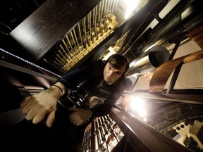 Organ curator Jerrold Eilander climbs down the narrow wooden ladder inside the nearly 13-metre Davis Concert Organ at the Winspear Centre in Edmonton Tuesday, Dec. 5, 2017.