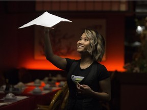 Kuemoo Eh demonstrates the Blue Willow Restaurant's signature towel spin in Edmonton on Friday, Dec. 29, 2017.