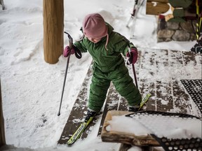 Gabi Grandi holds in her left hand the ski pole made famous by her mother, Sara Renner, during the 2006 Olympics.